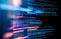 closeup view of computer screen showing lines of digital code. Blurred image essence of data processing, with visible lines of Royalty Free Stock Photo