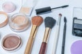 Closeup view on cosmetics, makeup and brushes on white background Royalty Free Stock Photo