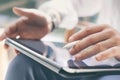 Closeup view of coworker holding digital tablet on hand and using electronic pen while working at office.Pointing tablet Royalty Free Stock Photo