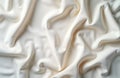 Closeup view of crumpled white linen fabric. Smooth surface. Abstract texture. Natural material. Versatile background for design