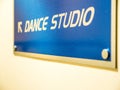 Closeup view dance studio directional sign inside sport centre