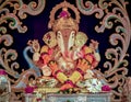 Closeup view of decorated and garlanded idol of Hindu God Ganesha in Pune, India