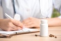 Closeup view of doctor working at desk in office. Medical service Royalty Free Stock Photo
