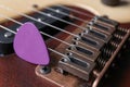 Closeup view of electric guitar, focus on bridge with strings