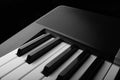 Side, perspective view of electronic synthesizer piano keys Royalty Free Stock Photo