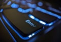 Closeup view of an enter key on black laptop keyboard with glowing blue lights Royalty Free Stock Photo