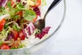 Fresh mixed salad in a glass bowl