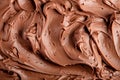 A closeup view of a generous swirl of chocolate whipped cream or smooth chocolate cream as background Royalty Free Stock Photo