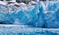 A mass of ice calving off a glacier face on South Georgia Island in the southern Atlantic Ocean. Royalty Free Stock Photo