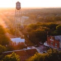 Closeup view of the Gruene water tower with buildings and trees in New Braunfels, Texas, USA