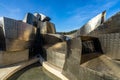 A closeup view of Guggenheim Museum\'s modern facade in Bilbao Spain