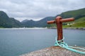 Closeup view of a harbor bollard with a marine rope Royalty Free Stock Photo