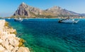 A closeup view of harbour traffic at San Vito lo Capo, Sicily with impressive mountain backdrop