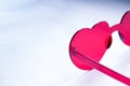 Closeup view of heart shaped sunglasses on light background with text space Royalty Free Stock Photo