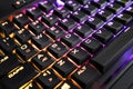 Closeup view of a keyboard with bright led lights for easy and comfortable using pc or notebook. High Tech concept.