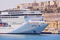 Closeup view of large cruise liner ship in Valletta Grand harbor in Malta with in sea bay Royalty Free Stock Photo