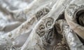 closeup view on luxurious brocade fabric in intricate silver and white patterns Royalty Free Stock Photo