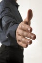 Closeup view of a man in elegant business suit offering his hand Royalty Free Stock Photo