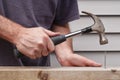 Man Hammering Nail Royalty Free Stock Photo