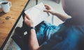 Closeup view of man holding digital tablet on hand and using while sitting in armchair at coworking place. Pointing hand Royalty Free Stock Photo