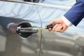 Closeup view of man opening car door Royalty Free Stock Photo