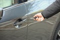 Closeup view of man opening car door Royalty Free Stock Photo