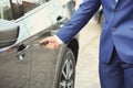 Closeup view of man opening car door Royalty Free Stock Photo