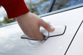 Closeup view of man opening car door outdoors Royalty Free Stock Photo