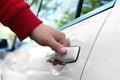 Closeup view of man opening car door outdoors Royalty Free Stock Photo