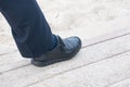 closeup view of man's leather black shoes,Businessman walking to the office Royalty Free Stock Photo