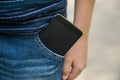 Modern black smartphone inside of pocket Royalty Free Stock Photo