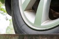 Closeup view of an old dirty car wheel with winter tires and silver brake disc. Selective focus Royalty Free Stock Photo