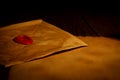 Closeup view of old envelope with wax seal stamp Royalty Free Stock Photo