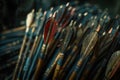 Closeup view of oldfashioned wooden archery arrows with various feather fletchings