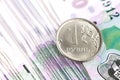 One ruble coin on the one thousand russian banknotes Royalty Free Stock Photo