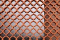 Closeup view of ornate brown fence outdoors