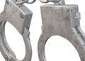 Closeup view of a pair of handcuffs against a white backdrop Royalty Free Stock Photo