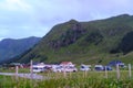 Closeup view of a parking area on the slope of the mountain with lot of cars