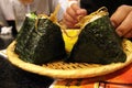 Closeup view of plate of Onigiri or riceball and beer at Kaniya Honten restaurant in Nagasaki Royalty Free Stock Photo