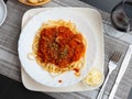 Closeup view of plate of spaghetti with Bolognese sauce