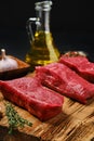 Closeup view of raw boneless strip steak loin on cutting board Royalty Free Stock Photo