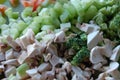 Closeup view of raw diced mixed vegetables on cutting board