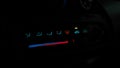 Closeup view of red and blue car indicators in the dark of night Royalty Free Stock Photo