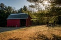 Closeup view of a red color barn in the middle of the forest Royalty Free Stock Photo