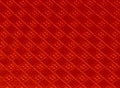 Closeup view of a red surface carved like a rhombus - good for background