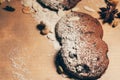 Round crispy chocolate cookies with spices and nuts on a table