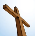 Wooden cross on sky background. Vector drawing