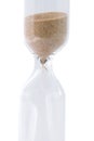 Closeup view of sand flowing through an hourglass Royalty Free Stock Photo