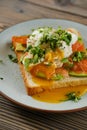 Closeup view of sandwich with trout, avocado and poached egg