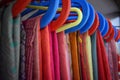 Closeup view of saris or sarees hung on hangers in display of retail shop,india culture and tradition Royalty Free Stock Photo